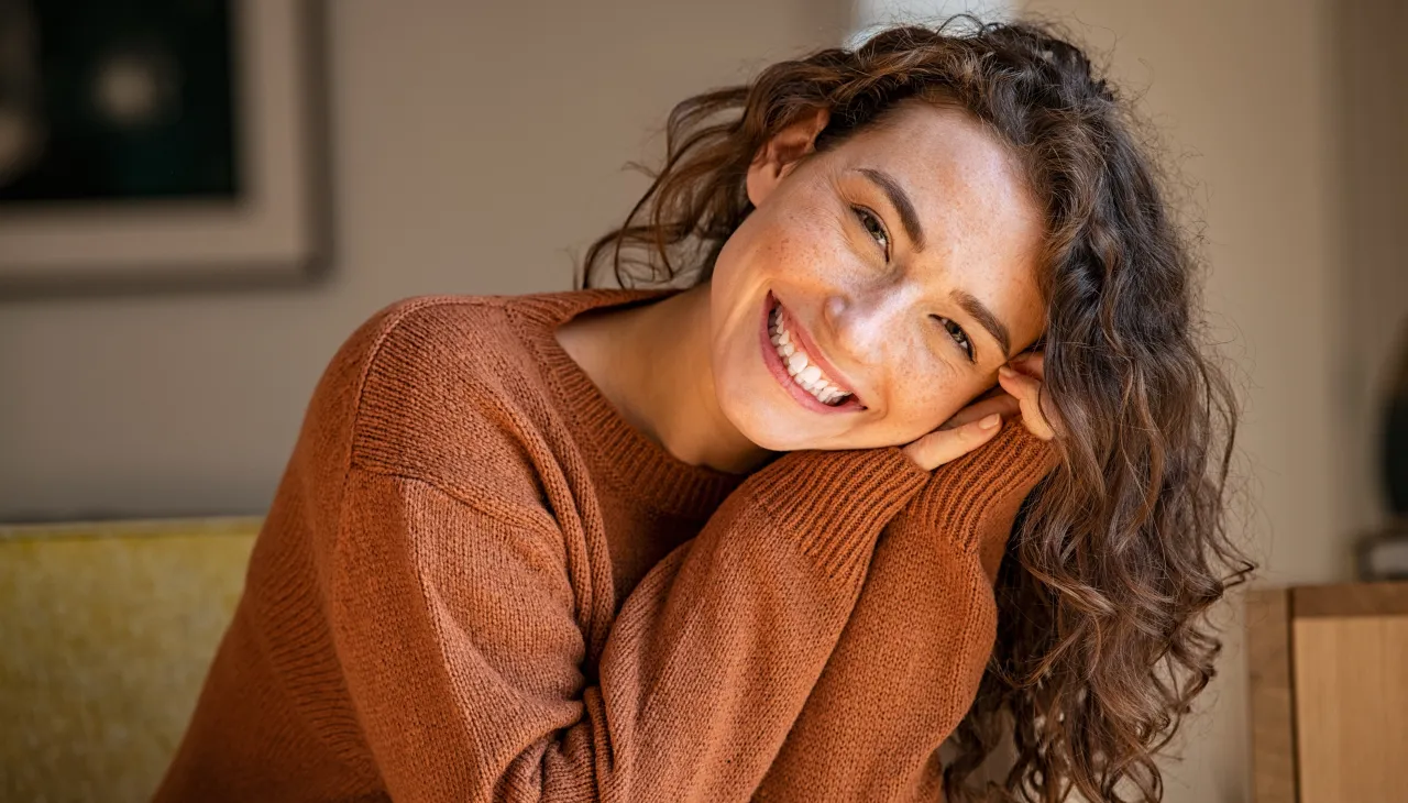 Smiling woman representing FemExcel's women's hormone health and weight loss telehealth program