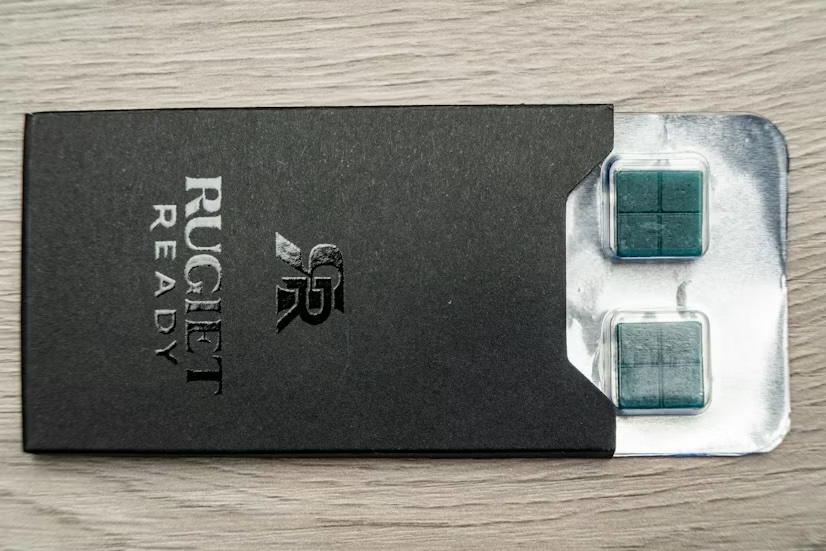 Rugiet Ready sublingual troche packaging opened on a tabletop, showing the actual product patients receive